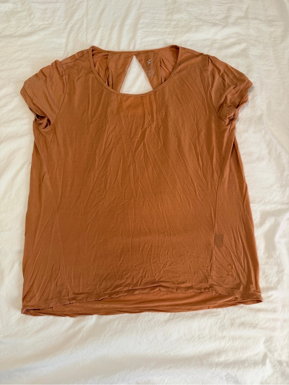 On Running Women's Core-T size XL in orange color.